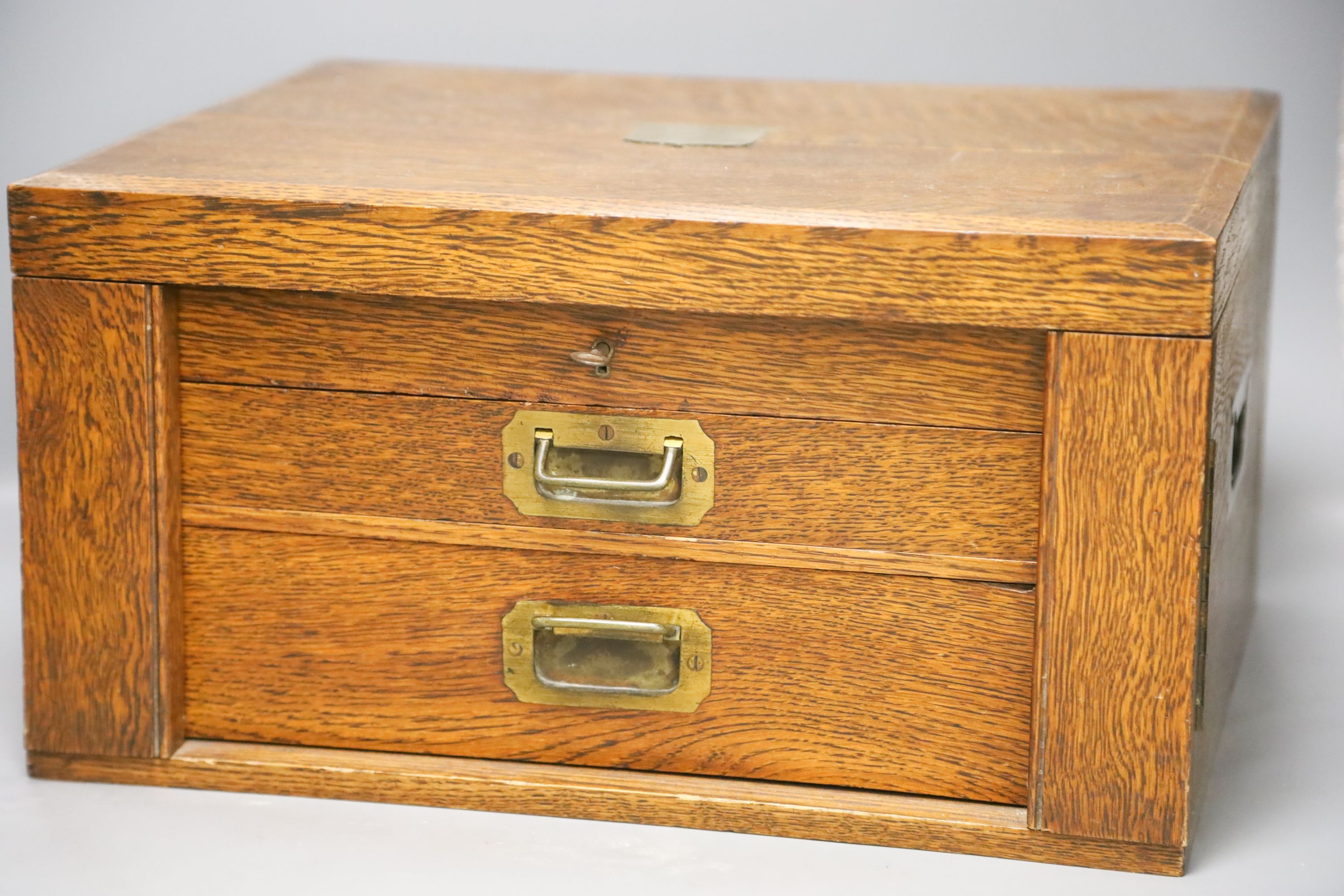 An Edwardian oak cased canteen of plated Kings pattern cutlery